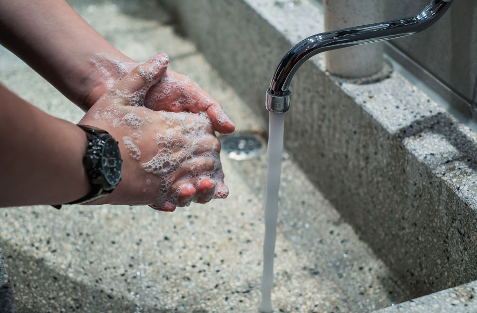 Washing hands in sink